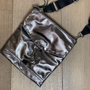 REBECCA MINKOFF, the Megan Small Feed Bag - Metallic/Black Crossbody